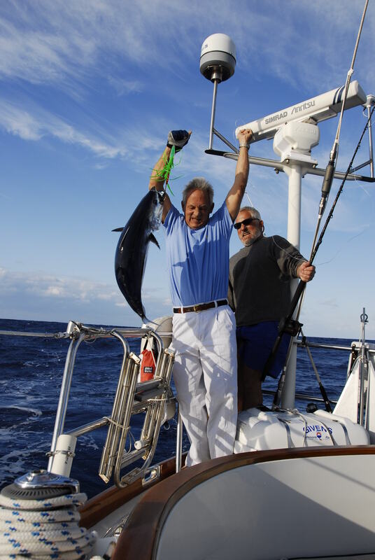 Bringing in a fat little tuna I caught on the way to Bermuda one year.